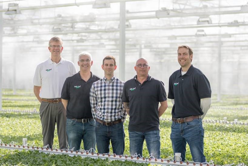 Reference story Little Leaf Farms growers posing in greenhouse