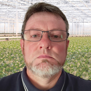 man in greenhouse